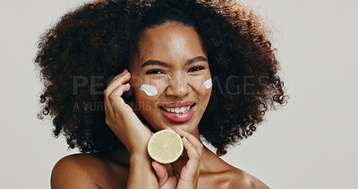 Buy stock photo Lemon, face cream and portrait of woman for skincare, natural products and vitamin c. Dermatology, spa and person with fruit for facial wellness, organic cosmetics and beauty on studio background