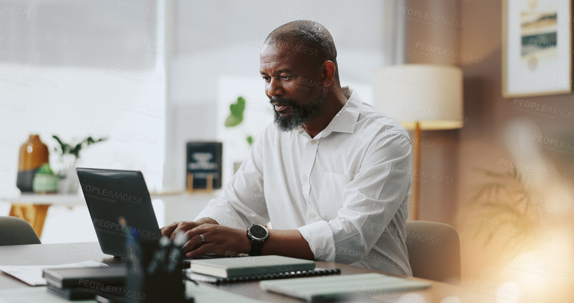 Buy stock photo Office, black man and typing with laptop for research, copywriting and newsletter for publication. Creative agency, mature person and journalist with digital for business story, proofreading and blog