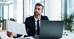 Businessman, documents and laptop with financial report for corporate finance or performance at office. Man, accountant or analyst with paperwork, graph or chart for company budget at workplace
