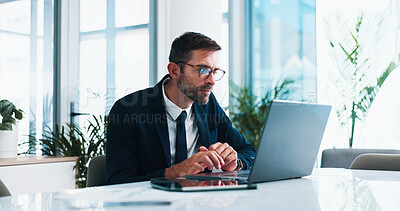 Buy stock photo Man, lawyer and research with laptop in office for reading, decision or review evidence for tax fraud case. Person, attorney and pc for financial crime, info or money laundering at corporate law firm