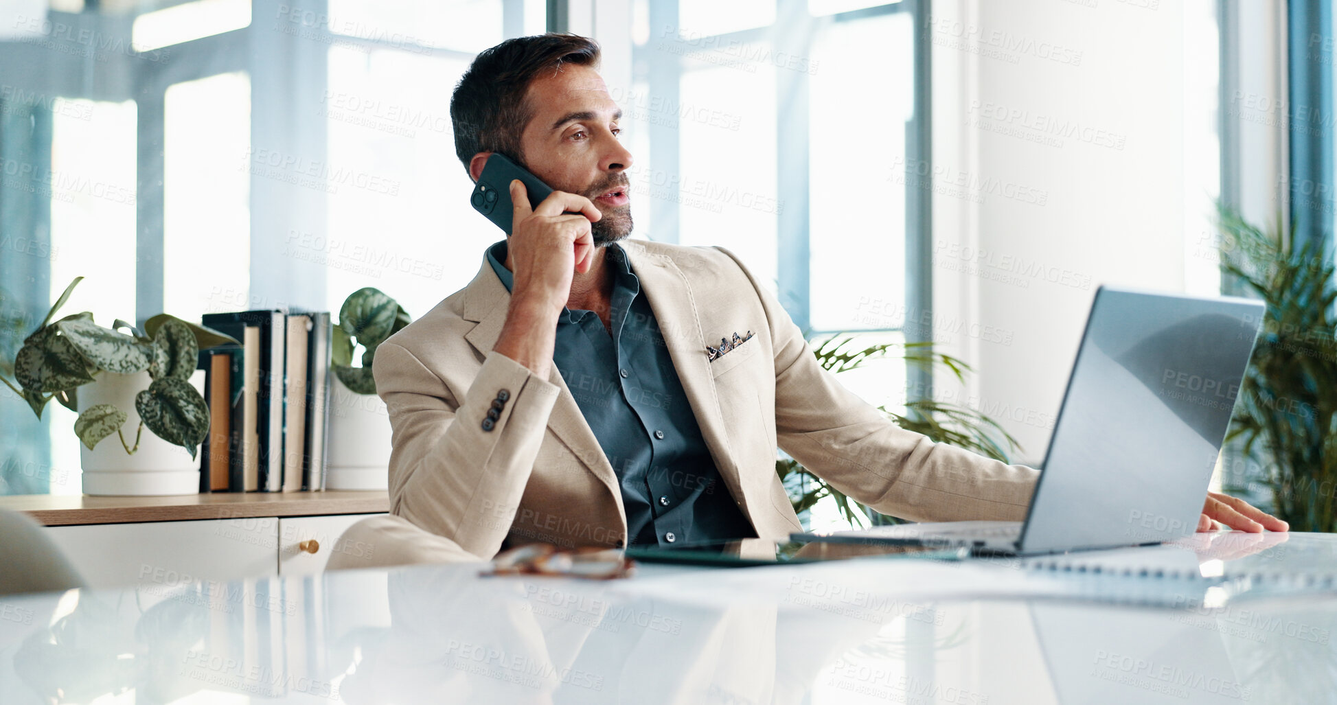 Buy stock photo Businessman, phone call and laptop in office for planning, feedback or consultation for financial advice. Broker, tech or contact in agency for budget review, research pitch or economy news update