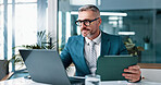 Mature business man, tablet and laptop for financial email, revenue and investment. Digital technology, corporate and manager reading online for share price, trading information and profit in office