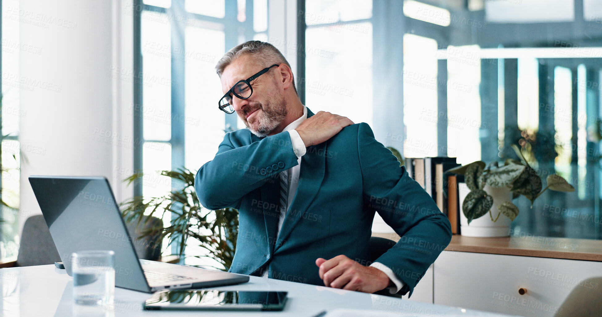 Buy stock photo Hurt, mature man and shoulder pain in business, overworked and employee with discomfort of injury. Corporate, pressure and person with inflammation, laptop and accountant with muscle strain in office