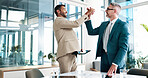 Business, people and celebration with high five in office for funding approval, investment success and good news. Financial teamwork, men and happy with budget achievement, digital review and goals