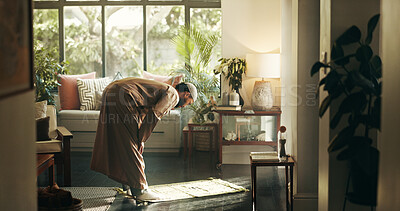 Buy stock photo Muslim, man and bow for praying at house of spiritual worship, praise Allah and belief in Ramadan. Male person, prayer or dua in salah, forgiveness and mindfulness of fasting tradition in Islam faith