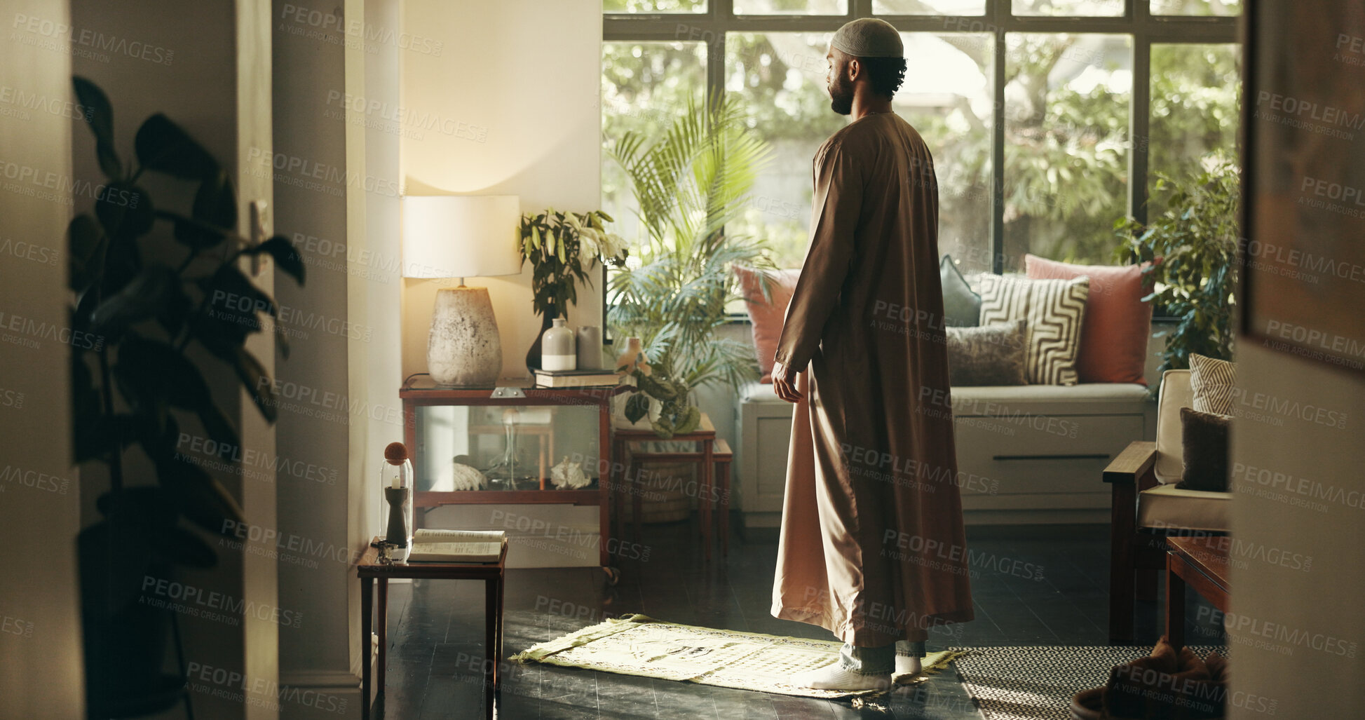 Buy stock photo Islamic, man and praying with faith at house for spiritual worship, praise Allah and belief in Ramadan. Muslim person, prayer and dua in salah, reflection and mindfulness for fasting tradition of God
