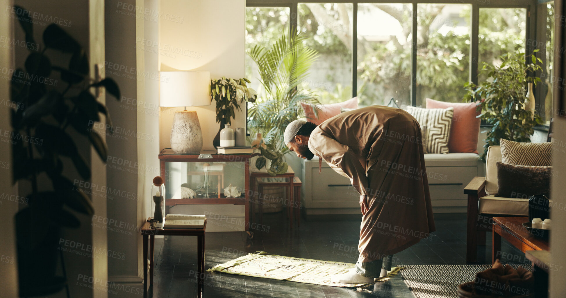 Buy stock photo Muslim, man and bow in prayer with faith at house of spiritual worship, praise Allah and Ramadan belief. Person, praying and dua in salah, forgiveness and mindfulness of fasting tradition of religion