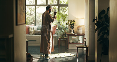 Buy stock photo Muslim, man and islamic prayer with faith at house for spiritual worship, praise Allah and Ramadan belief. Person, salah and dua for forgiveness, mindfulness and fasting tradition for guidance of God