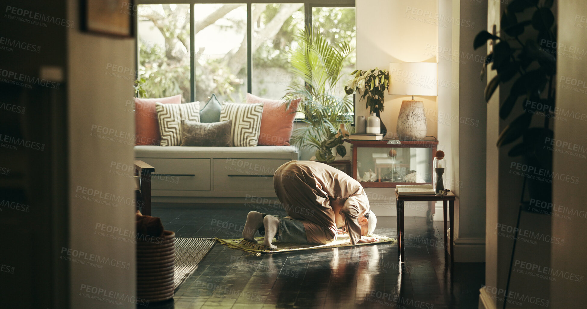 Buy stock photo Muslim, man or bow in islamic prayer at house for spiritual worship, praise Allah or Ramadan belief. Person, prostrate or dua for forgiveness, mindfulness or Islam tradition for guidance in religion