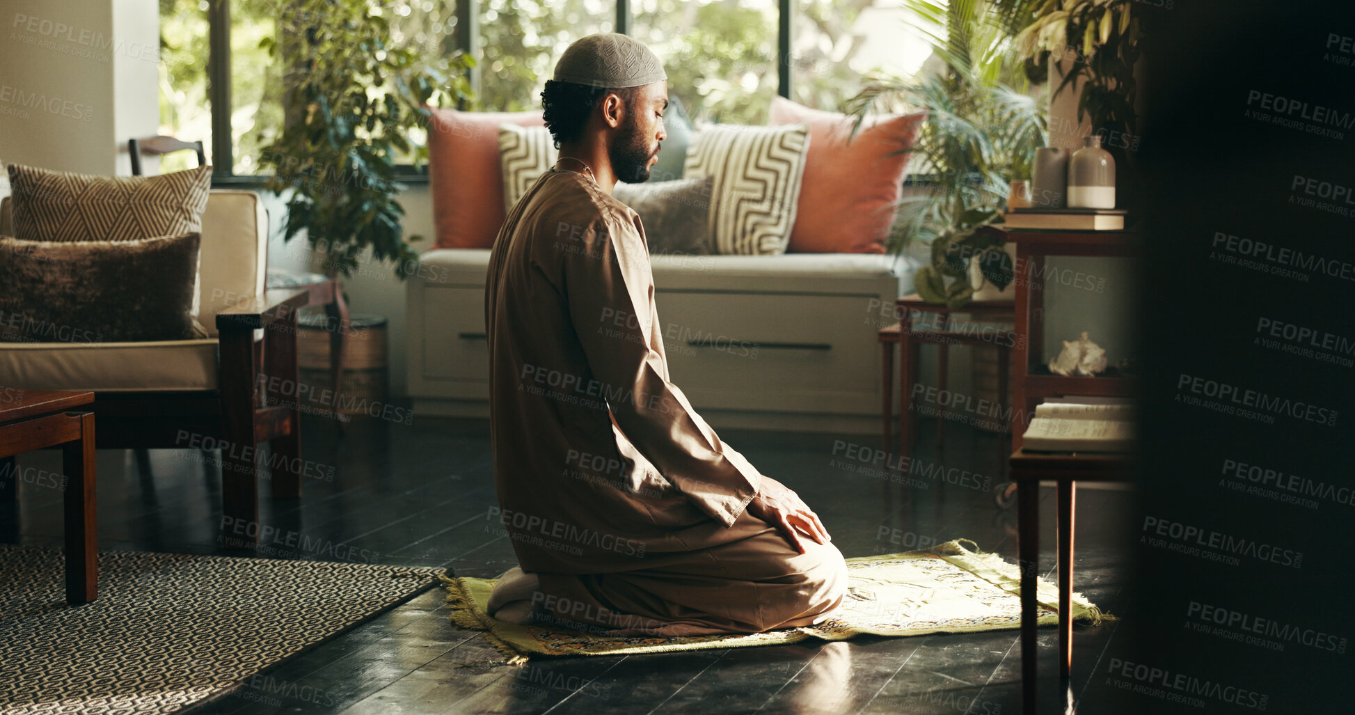 Buy stock photo Muslim, man and holy prayer at house of spiritual worship, praise Allah and belief in Ramadan devotion. Male person, salah and dua for forgiveness, mindfulness and fasting tradition of Islam religion