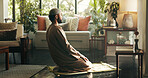 Muslim, man and praying to god at house for spiritual worship, praise Allah and Ramadan belief. Person, kneeling and dua for forgiveness, mindfulness and fasting tradition with guidance of protection