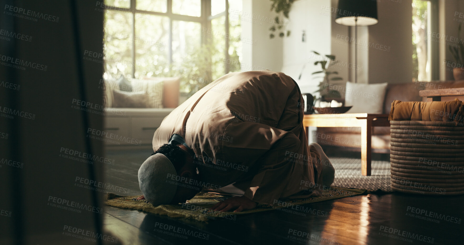 Buy stock photo Muslim, prayer and floor with man at home for gratitude, ramadan kareem and worship. Spiritual, peace and Islamic with person and dua in living room of apartment for eid Mubarak, Allah and religion