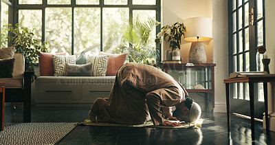 Buy stock photo Islam, worship and floor with man at home for ramadan kareem, spiritual and prayer. Religion, faith and eid Mubarak with Muslim person and salah in living room for gratitude, Allah praise and dua