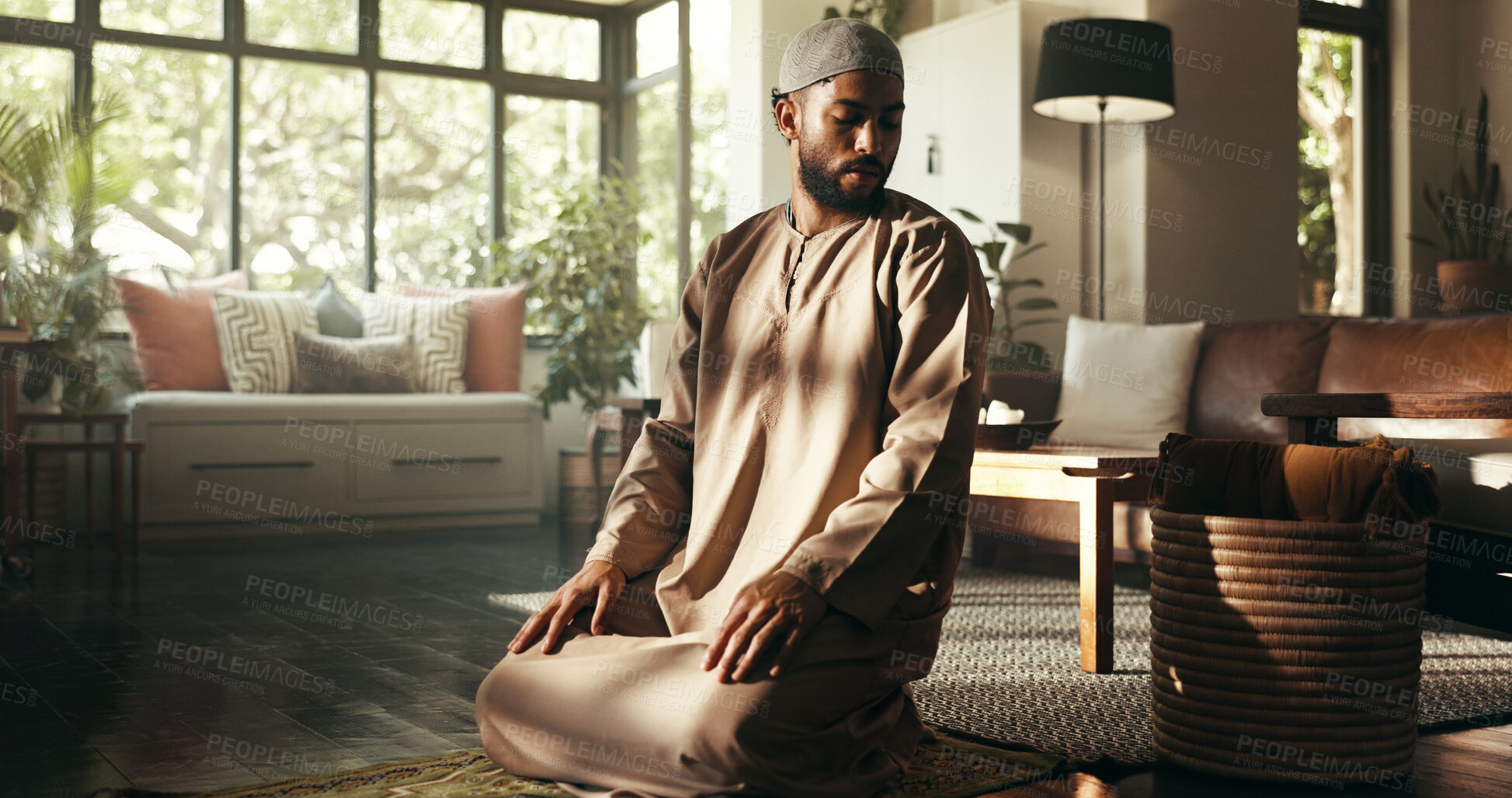 Buy stock photo Muslim, worship and religion with man at home for ramadan kareem, spiritual and prayer. Floor, faith and eid Mubarak with Islamic person and salah in living room for gratitude, Allah praise or salaam