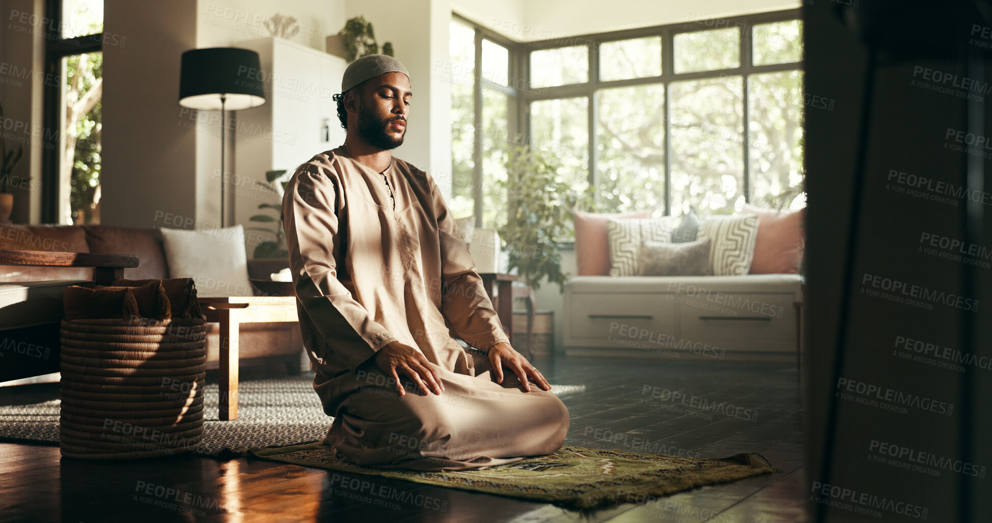 Buy stock photo Muslim, praise and religion with man at home for ramadan kareem, spiritual and prayer. Floor, faith and eid Mubarak with Islamic person and salah in living room for gratitude, Allah worship and dua