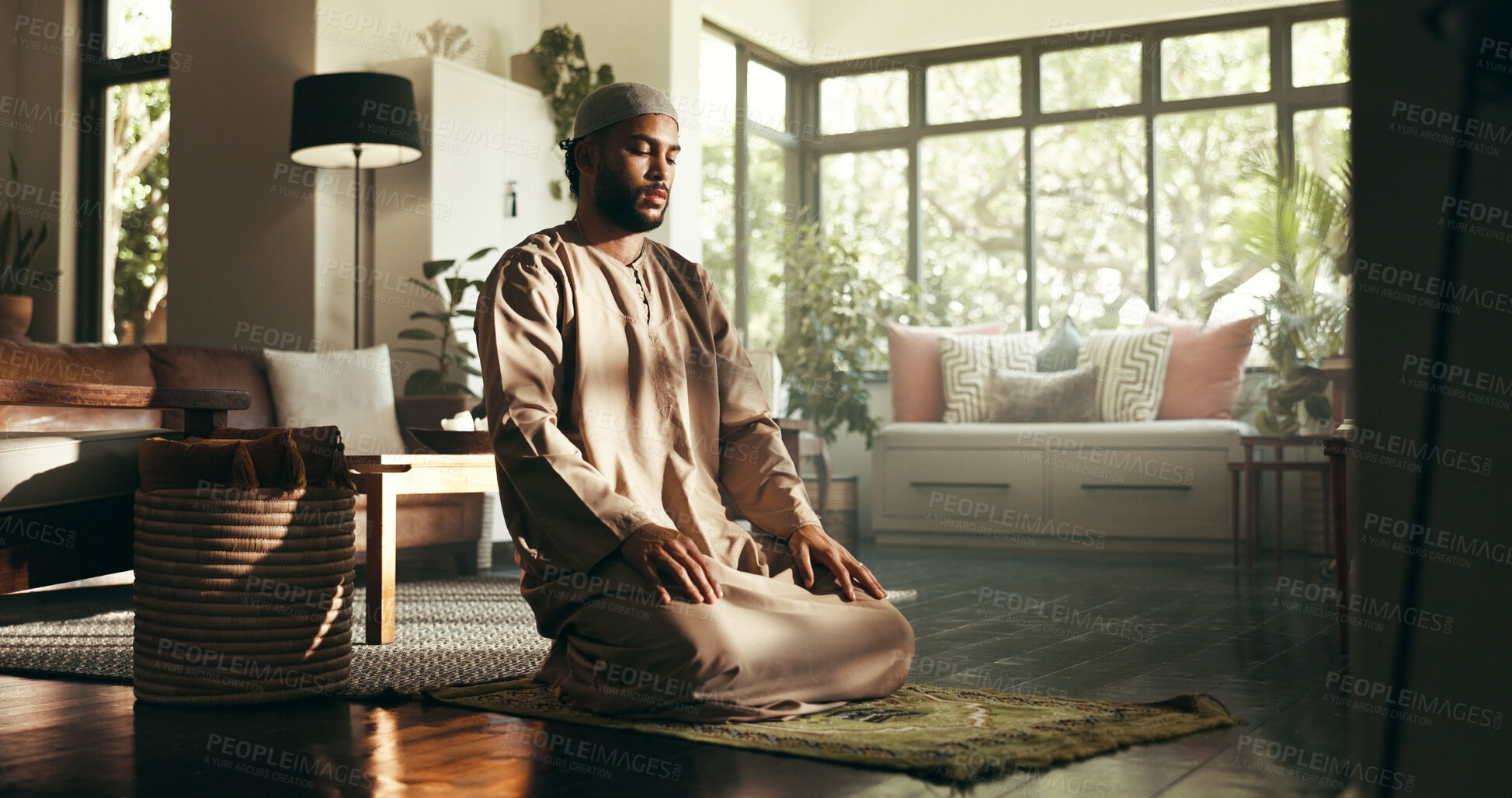 Buy stock photo Islam, prayer and holy with man in home for ramadan kareem, spiritual and worship. Religion, faith and eid Mubarak with Muslim person and salah in living room for gratitude, Allah praise and dua