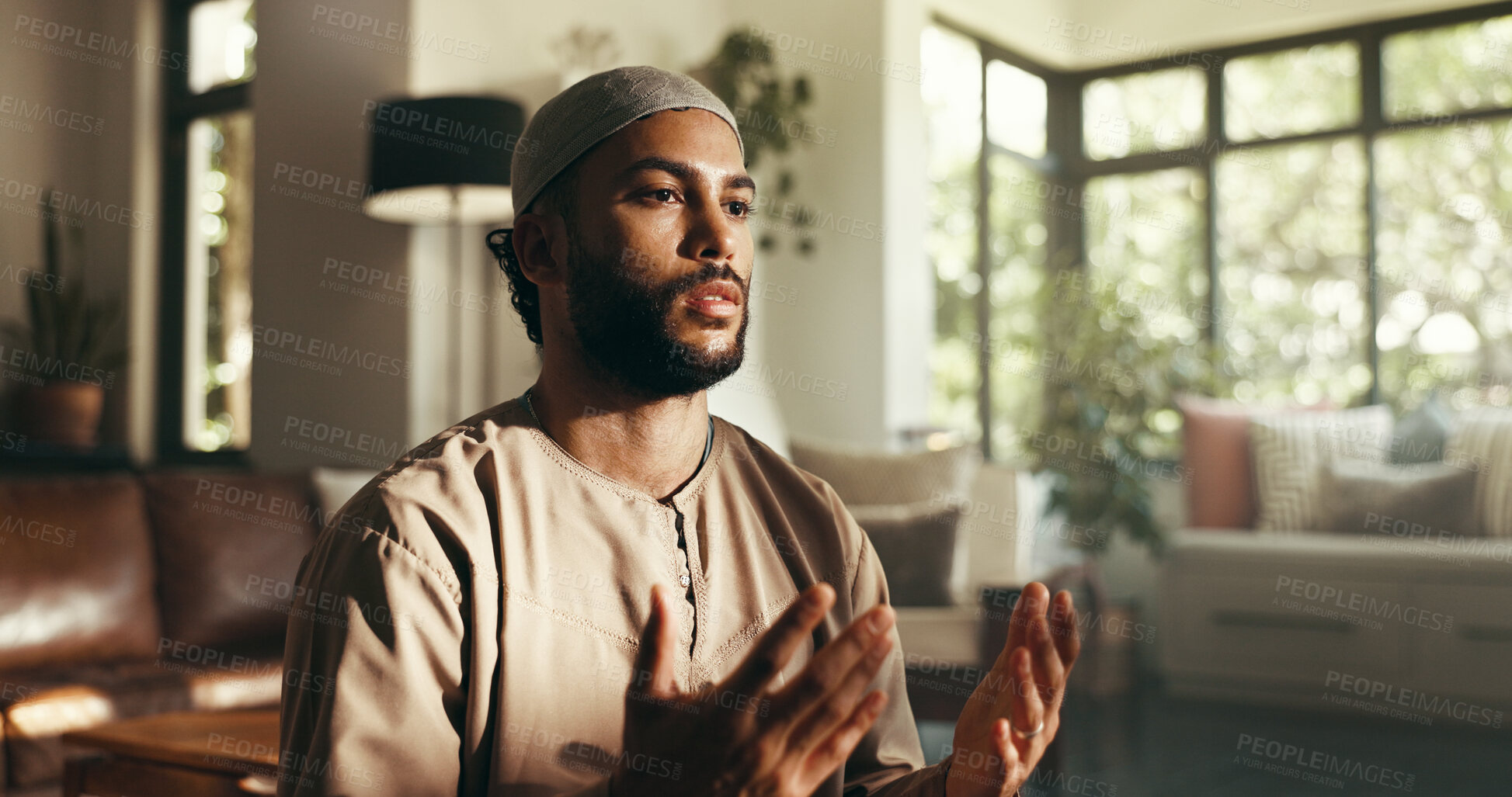 Buy stock photo Islamic, religion or man with prayer in home for spiritual meditation, fasting tradition or worship gratitude. Muslim faith, person or salah in living room for holy reflection, dua or praise to Allah