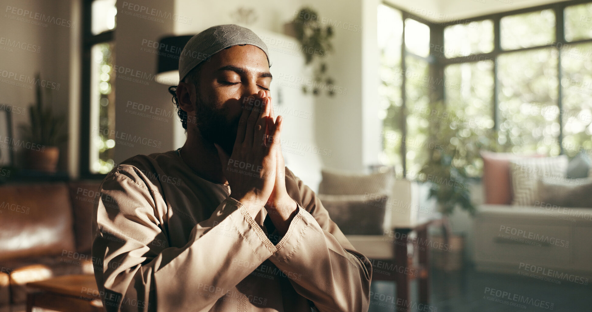 Buy stock photo Muslim, dua and faith with man at home for gratitude, ramadan kareem and worship. Spiritual, peace and Islamic with person and prayer in living room of apartment for eid Mubarak, Allah and religion