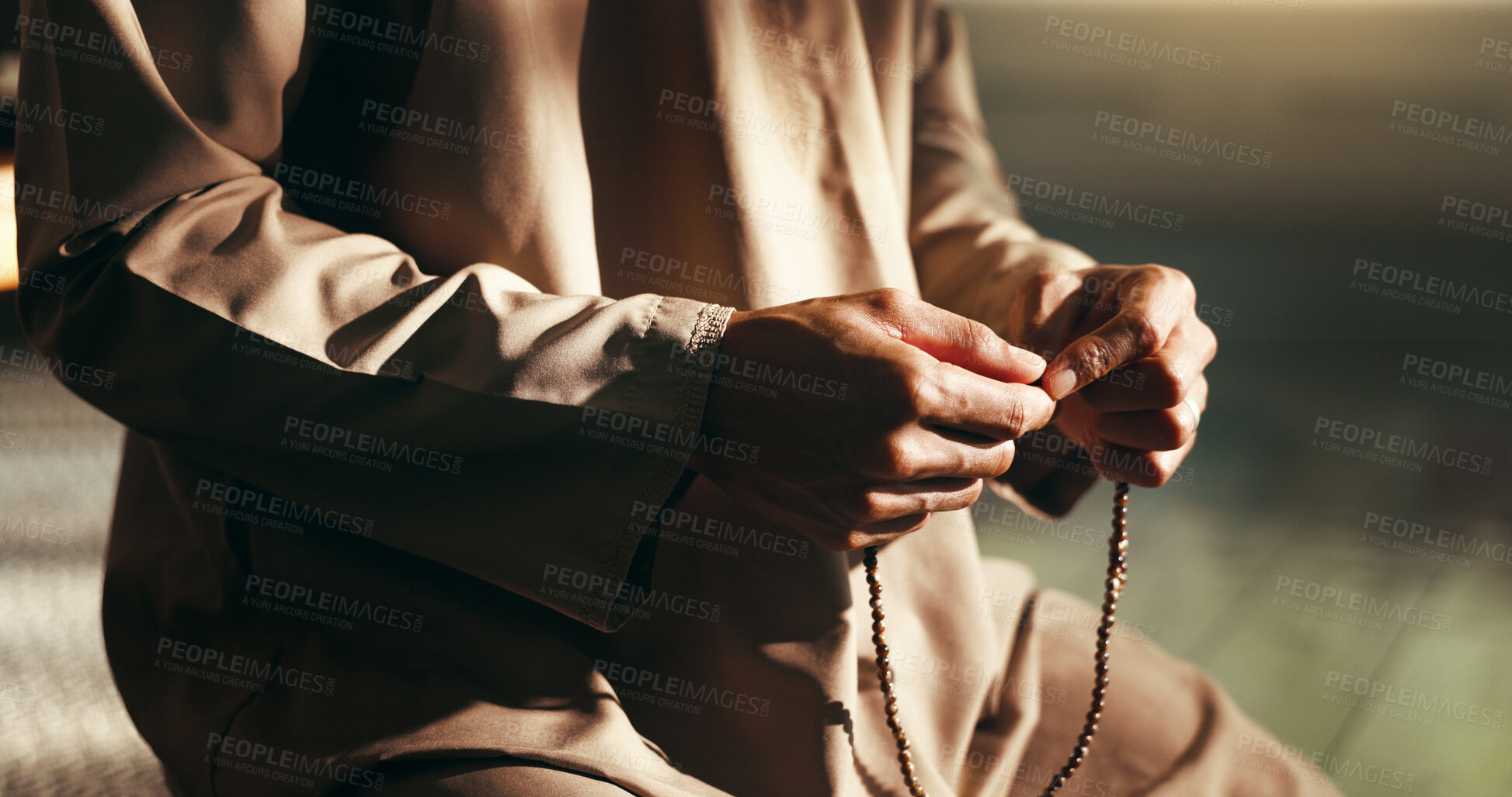 Buy stock photo Hands, Islam and prayer beads in home for faith on floor for relationship with Allah in morning. Muslim person, worship and religion with trust in God for fasting, dua or reflection at apartment