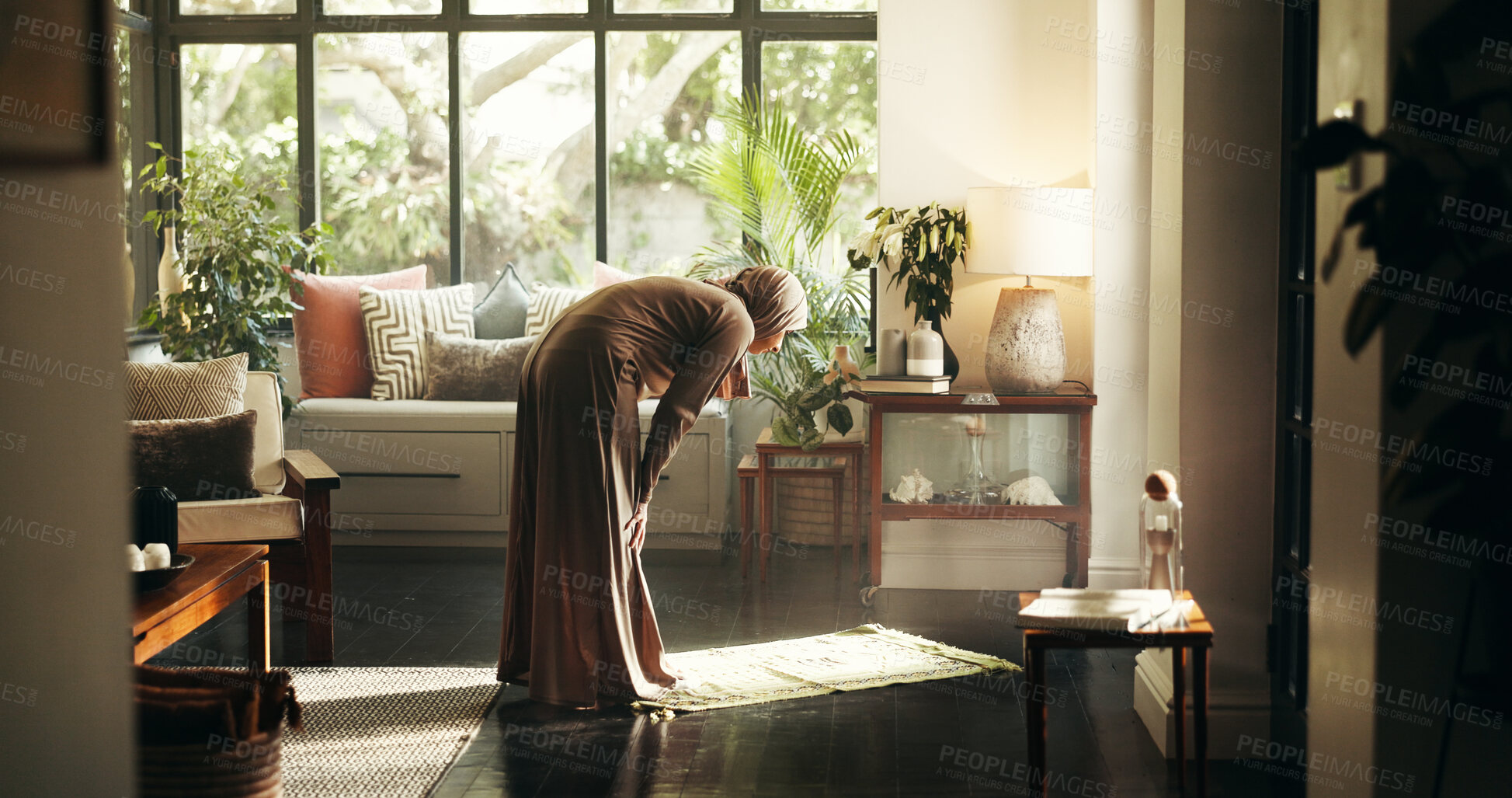 Buy stock photo Muslim, prayer and religion with woman in home for gratitude, ramadan kareem and worship. Spiritual, peace and Islamic with person and dua in living room of apartment for eid Mubarak, Allah and faith