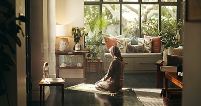 Buy stock photo Muslim woman, praying and mat in home for faith, Islam or relationship with Allah in morning. Person, hijab and back for Ramadan, religion and trust in God for fasting, dua or reflection at apartment