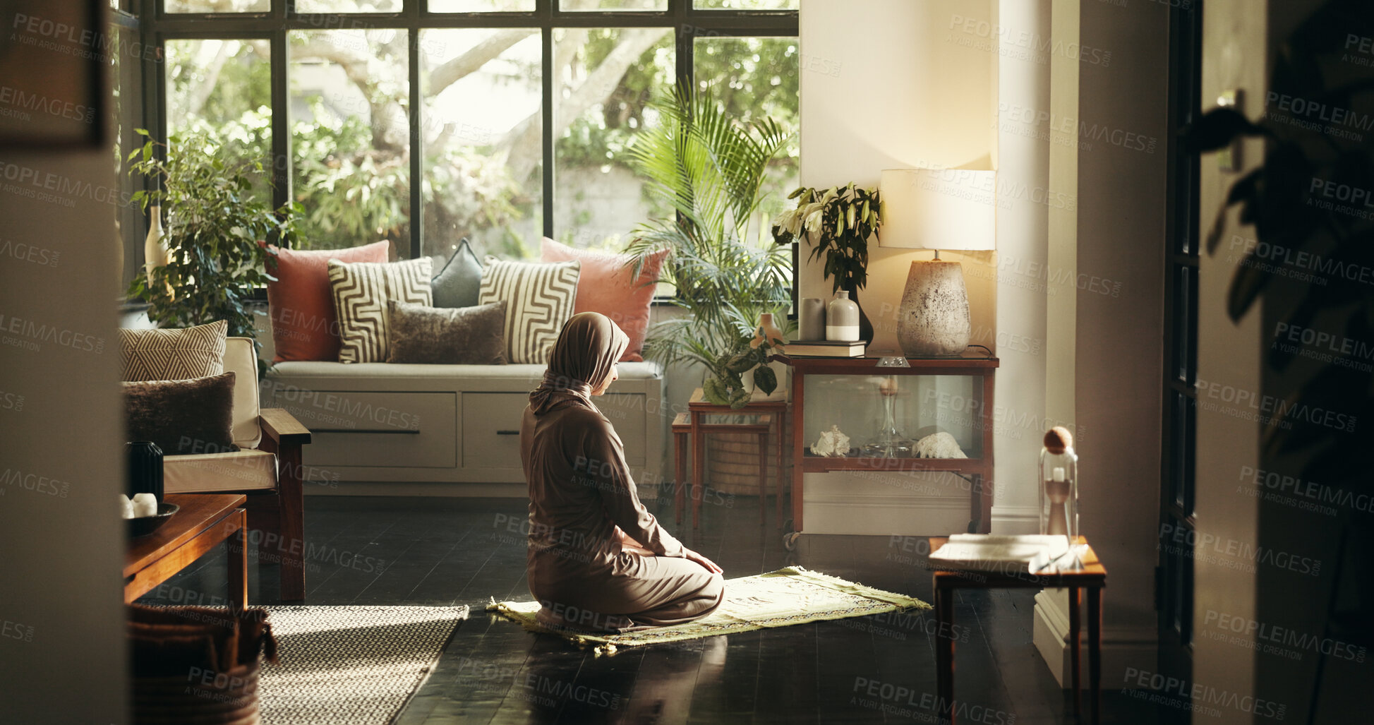 Buy stock photo Muslim woman, praying and mat in home for ramadan, Islam or relationship with Allah in morning. Person, hijab and back for faith, religion and trust in God for fasting, dua or reflection at apartment