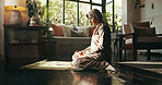 Muslim woman, prayer mat and faith in home, Islam and start morning with worship for Allah in living room. Person, hijab and Ramadan on floor to praise God with fasting, dua and profile at apartment