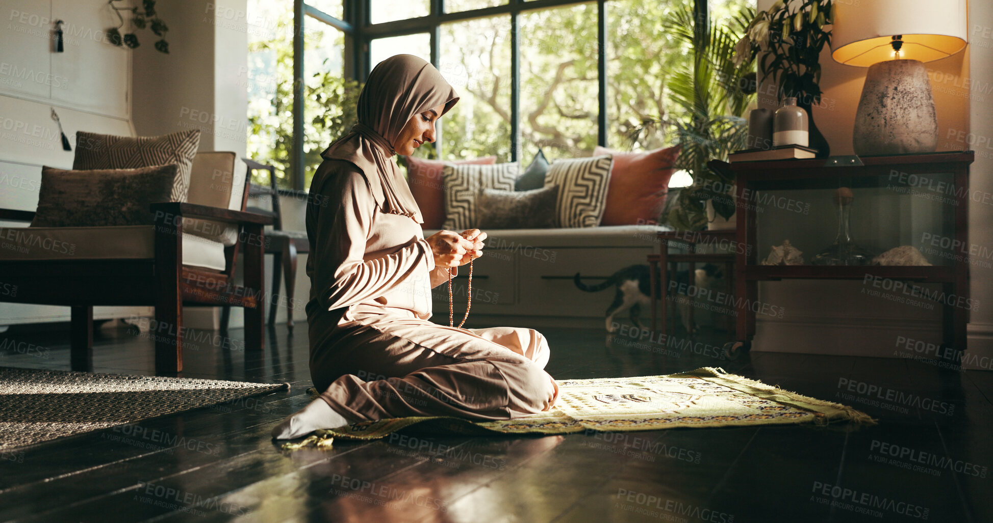 Buy stock photo Muslim woman, prayer mat and home for worship, Islam and start morning with faith for Allah in living room. Person, hijab and Ramadan on floor to praise God with fasting, dua and profile at apartment