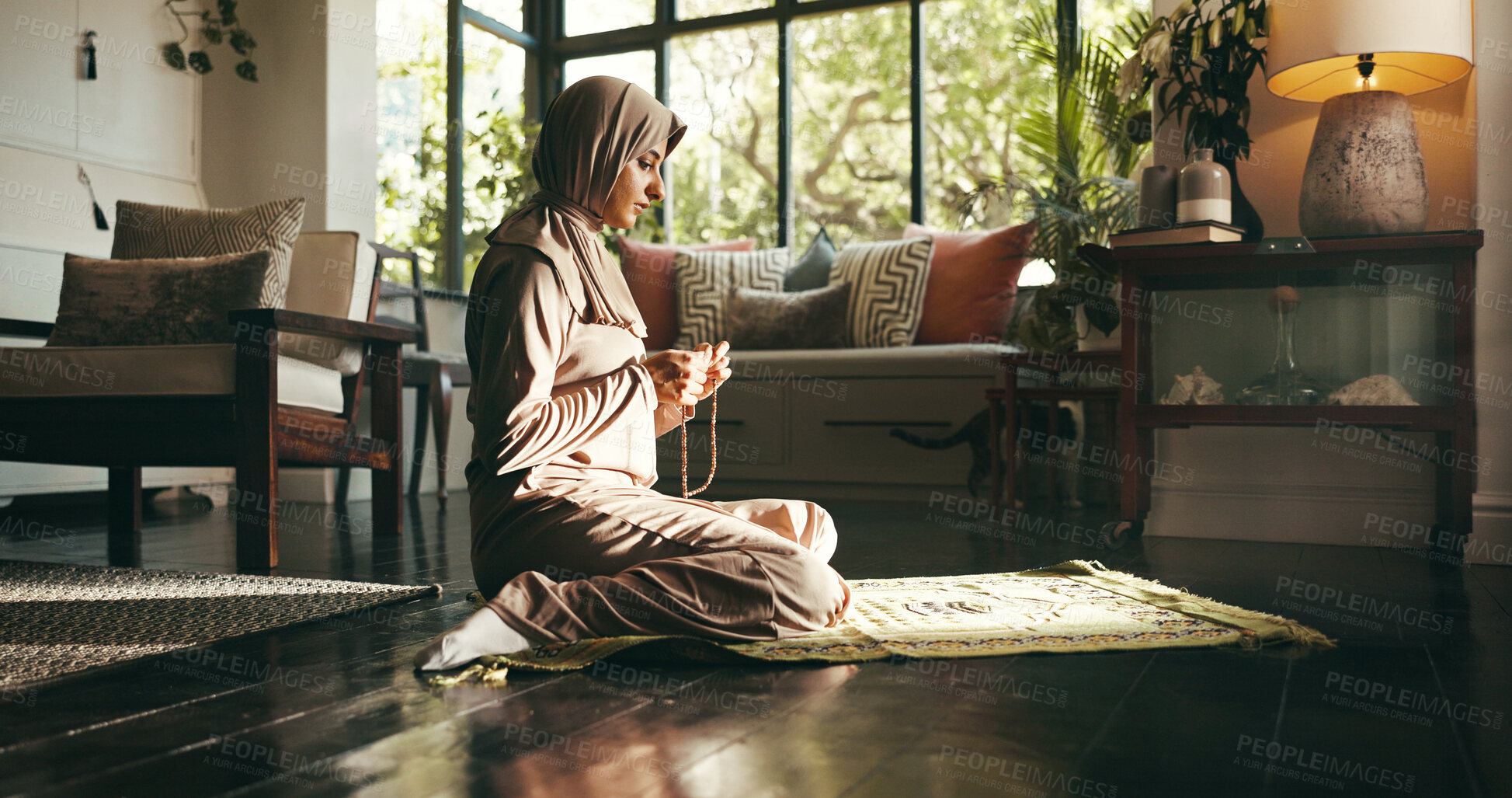 Buy stock photo Muslim woman, prayer beads and home for worship, Islam or start morning with religion for Allah in living room. Person, hijab and Ramadan on floor to praise God with fasting, dua and profile at house