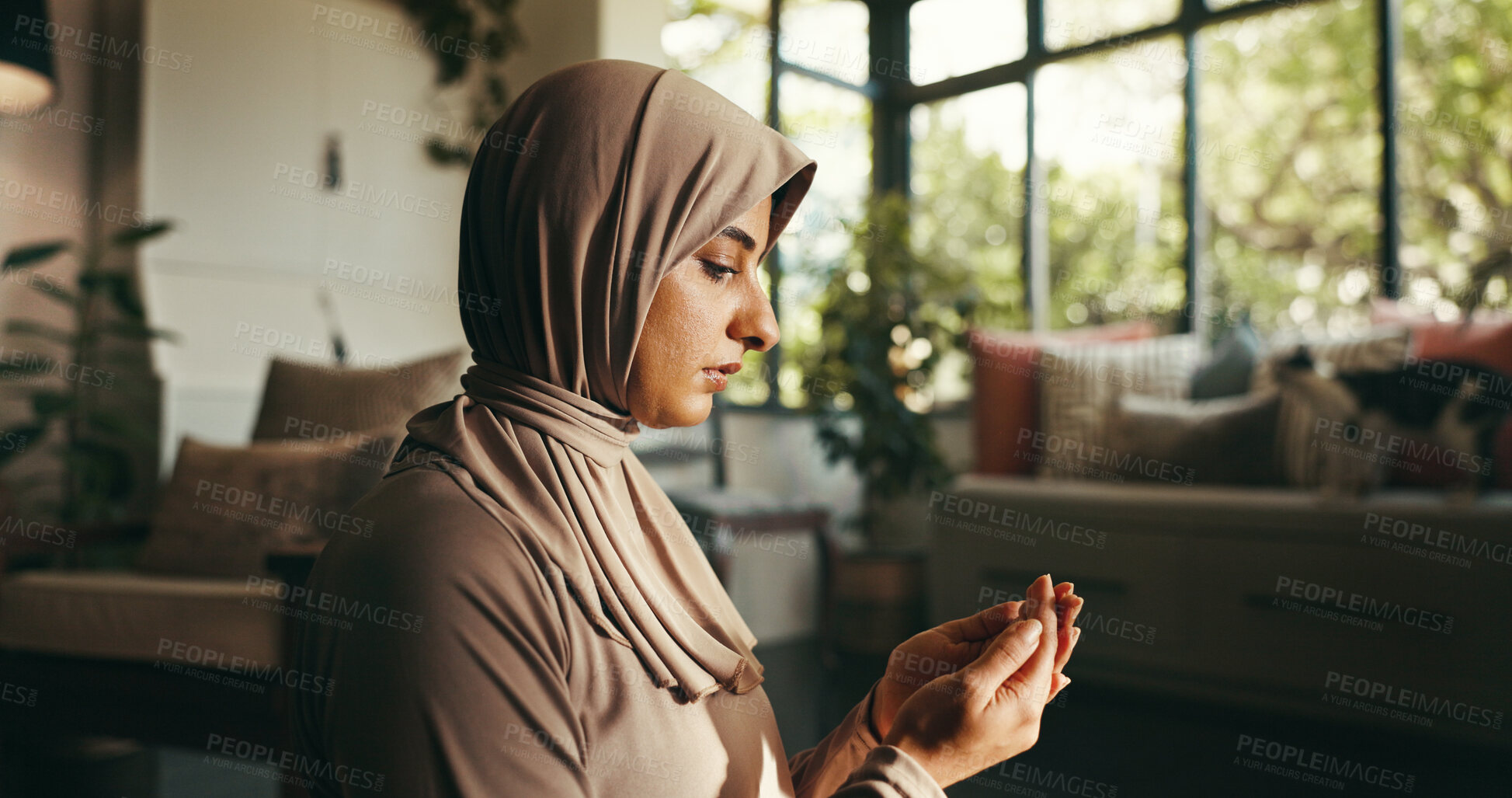Buy stock photo Islamic, faith and woman with praying in home for spiritual worship, religious gratitude and meditation on floor. Muslim belief, person and dua in living room for salah, blessing and praise to Allah