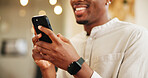 Man, hands and typing with phone for communication, social media or checkin at hotel. Closeup, male person or customer with smile on mobile smartphone for online post, network or connection at resort