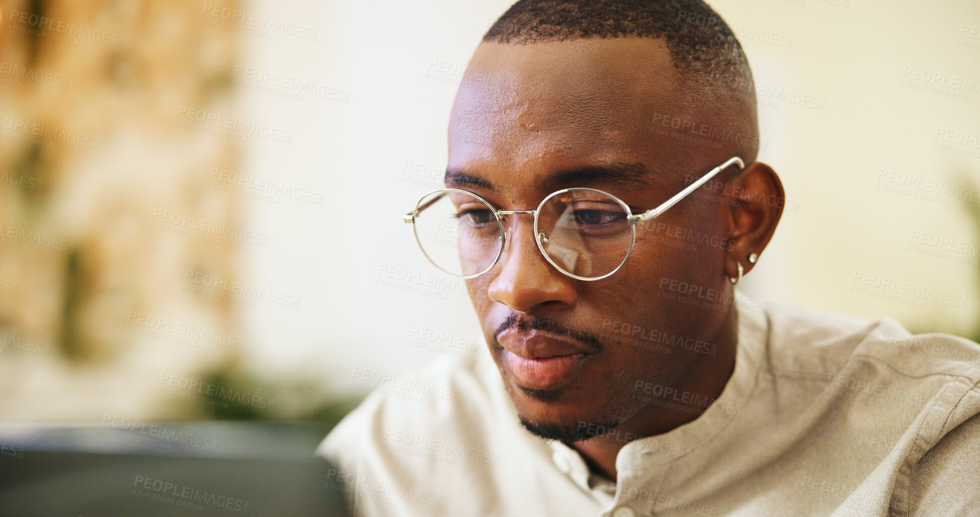 Buy stock photo Glasses, laptop and reading with business black man in office for editing or publishing. Computer, journalism and typing with creative employee in workplace for online magazine article or report
