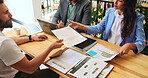Meeting, colleagues and people with documents, cafe or team with marketing proposal for campaign. Collaboration, above and planning with paperwork in coffee shop, brand manager or report for business