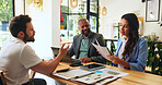 Planning, colleagues and people with documents, cafe or team with marketing proposal for campaign. Collaboration, smile and meeting with paperwork in coffee shop, brand manager or report for business