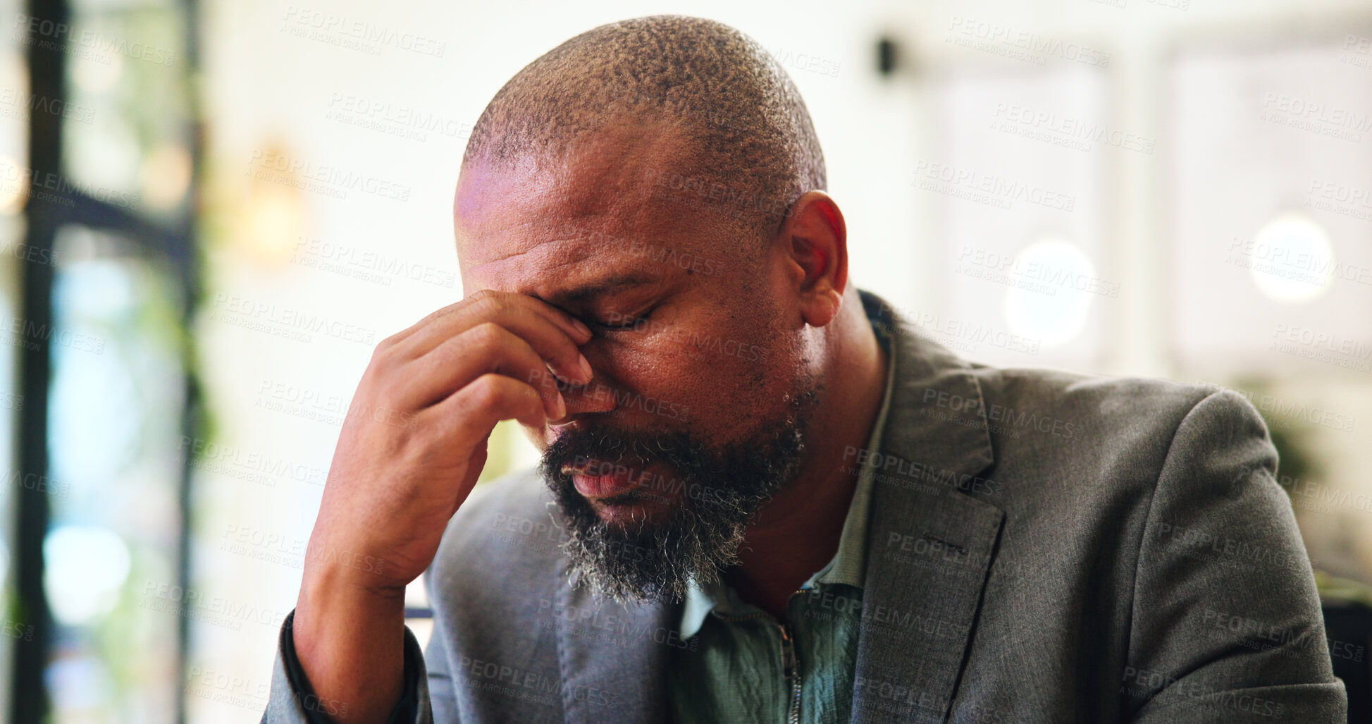 Buy stock photo Tired, frustrated or man in coffee shop with stress, headache or burnout for remote work. Eye strain, pain or black person in cafe with fatigue or mature freelancer with bad news for financial crisis