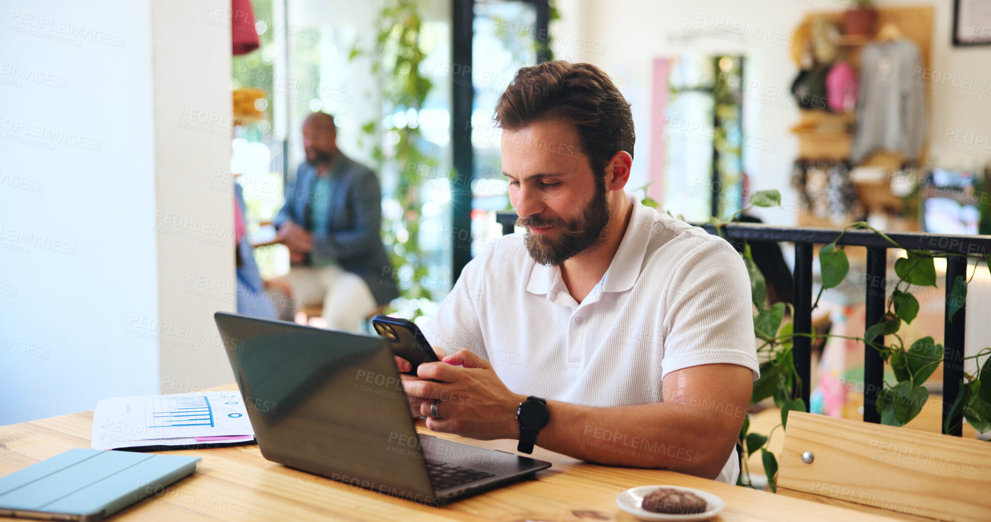 Buy stock photo Phone, laptop and freelancer with man in cafe for journalist, remote worker and research. Planning, editor feedback and networking with male person in coffee shop for article writing and update