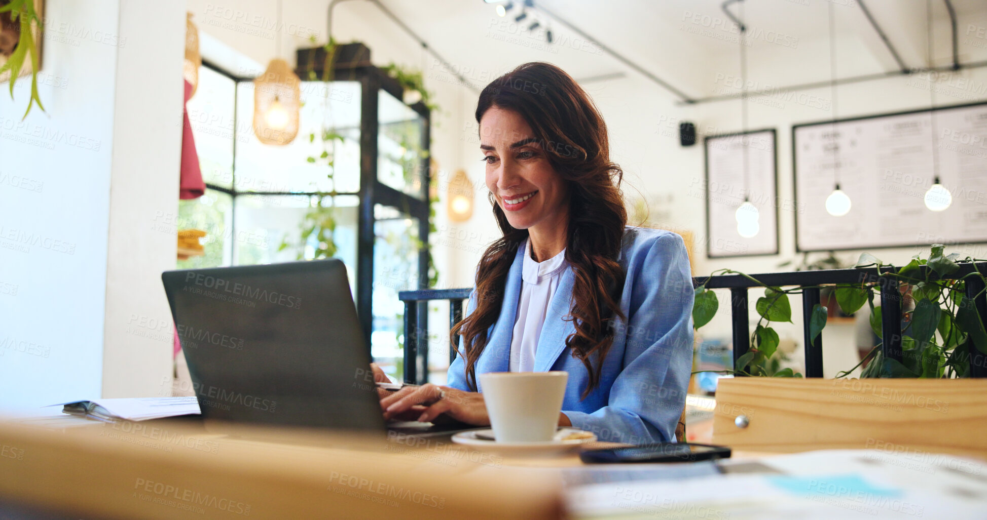 Buy stock photo Happy, business and laptop with woman in cafe for typing, remote worker and research. Planning, client feedback and online review with female person in coffee shop for email, idea and update