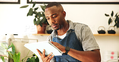 Buy stock photo Black man, barista and tablet in cafe for small business, order or communication schedule in startup. Technology, online or waiter in coffee shop for stock, check inventory or planning menu for sales