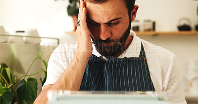 Buy stock photo Cafe, man or barista with stress, tablet or service, social media or cancelled order in small business. Headache, mental breakdown or tired waiter with migraine, technology or website with bad review