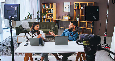Buy stock photo Conversation, laptop and podcast with people in home living room for live broadcast or recording. Camera, microphone or streaming with man and woman influencer in apartment for subscription service