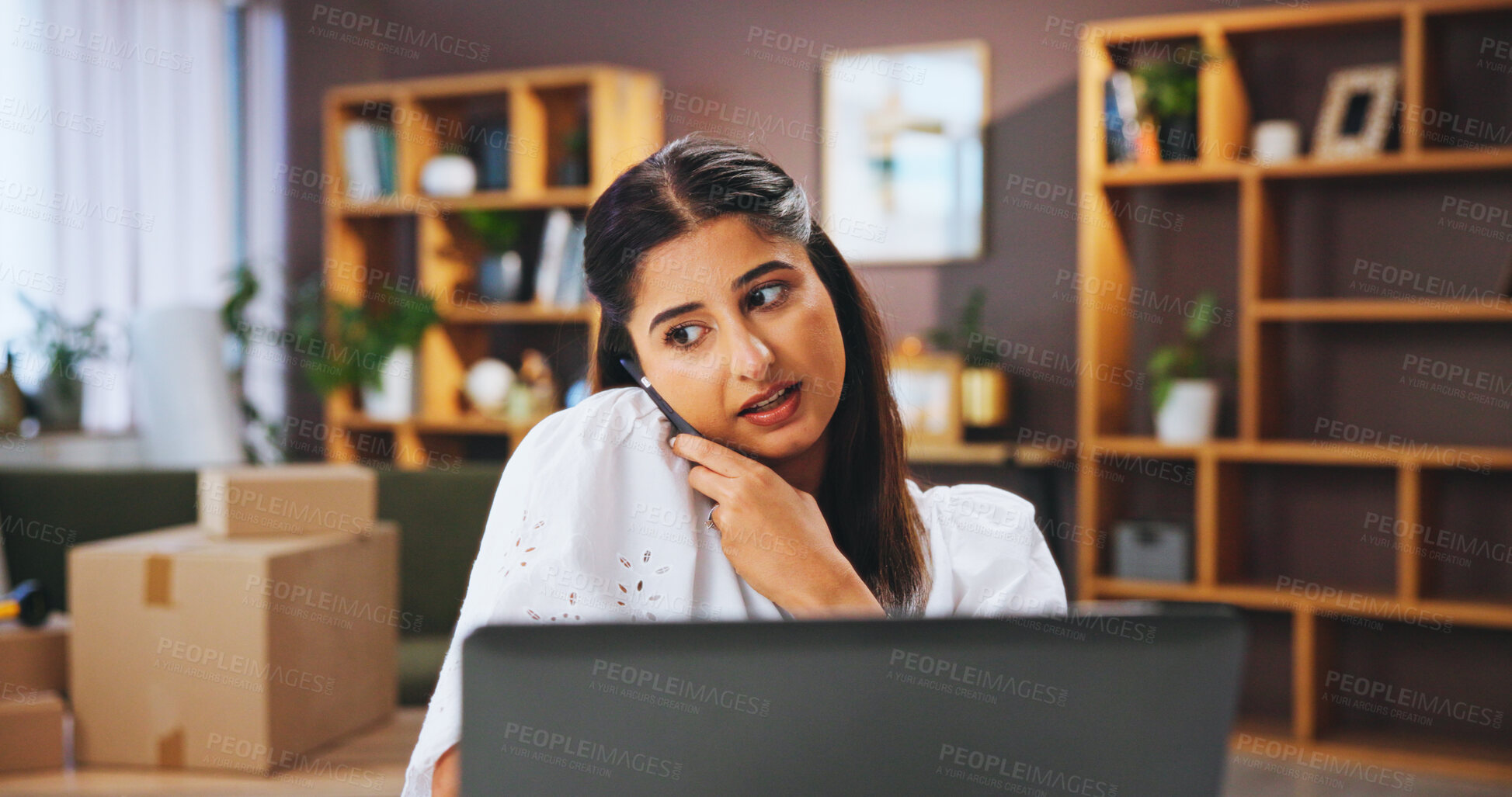 Buy stock photo Small business, phone call and woman in home with laptop, shipping and boxes for ecommerce sales. Contact, website and person with smartphone, supplier delivery or communication for online networking
