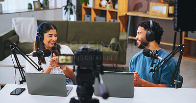 Buy stock photo Laptop, microphone and podcast with people in home living room for live broadcast or recording. Camera, conversation or streaming with man and woman influencer in apartment for subscription service