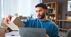 Small business, check and man with box, laptop and planning for order with cardboard, serious or digital. Logistics, entrepreneur and reading label for dropshipping, review or package for online shop