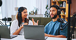 Laptop, podcast and streaming with people in home living room for live broadcast or recording. Computer, conversation or microphone with man and woman influencer in apartment for subscription service