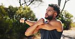 Man, fitness and stretching with arm on mountain for workout preparation, exercise or outdoor training. Active, male person or thinking with warm up for sprint, challenge or race on trail in nature