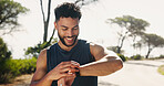 Happy man, fitness and checking with smart watch for performance, tracking health or heart rate in nature. Active, male person or smile with wristwatch in joy for sport app, wellness or step counter
