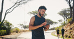 Outdoor, online and man with smartphone, fitness and planning for workout on app, confused or nature. Browsing, athlete and tracking performance on website, digital or runner with mobile for exercise