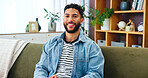 Portrait, man and relax with smile in home for weekend break, peaceful and unwind in apartment. Living room, person and comfortable on sofa for day off, pride and chill with confidence and positivity