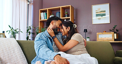 Buy stock photo Home, relax and couple on sofa, hug and bonding together with weekend break, support and care. Embrace, apartment and man with woman, marriage and love with romance, relationship and smile in lounge