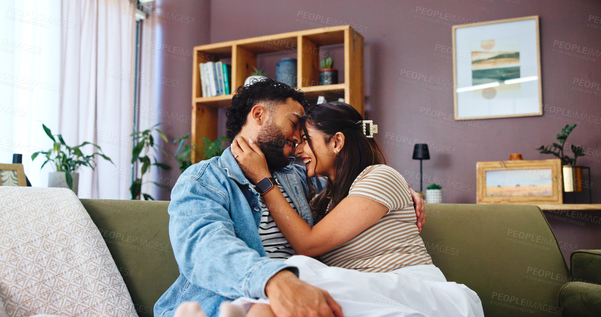 Buy stock photo Home, relax and couple on sofa, hug and bonding together with weekend break, support and care. Embrace, apartment and man with woman, marriage and love with romance, relationship and smile in lounge